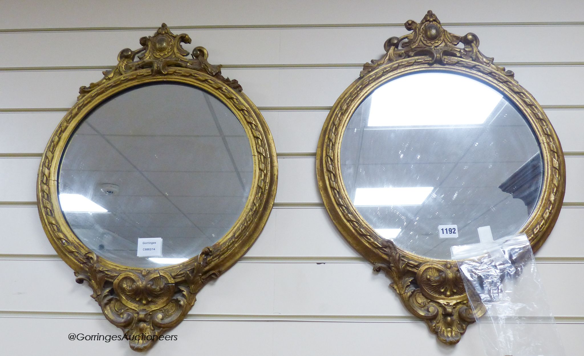 A pair of Victorian circular gilt wood and gesso wall mirrors. W-44, H-64cm.